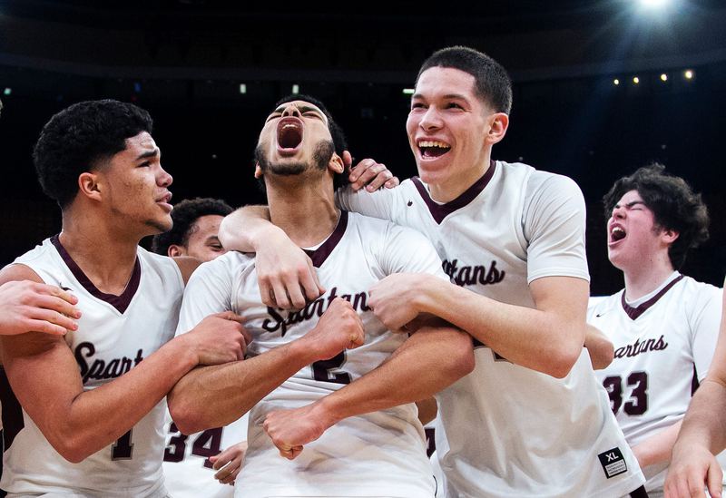 Basketball teammates shouting after a big play