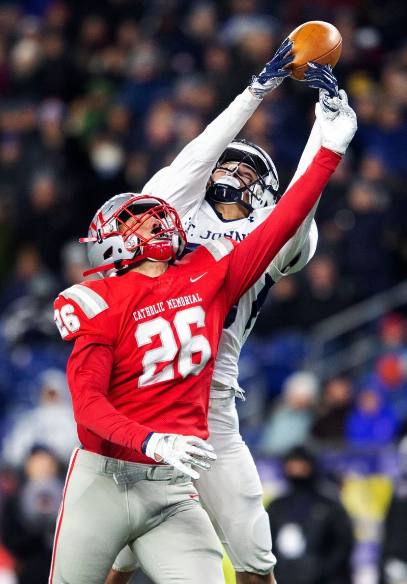 Receiver in a red 26 jersey making a catch